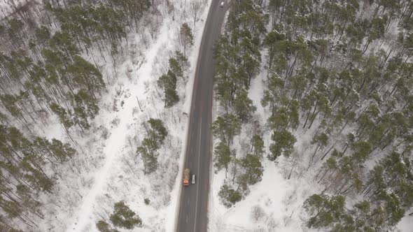 Aerial View Traffic Road Near The Winter Forest