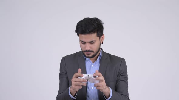 Young Bearded Indian Businessman Playing Games