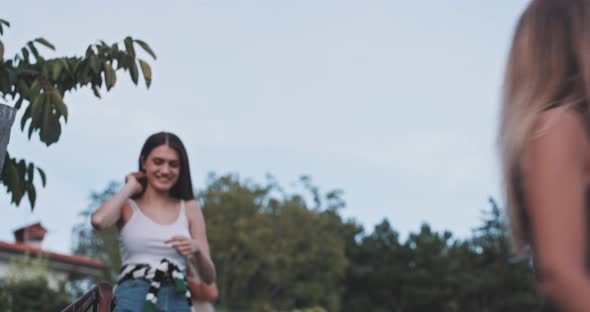 Young women smiling and walking