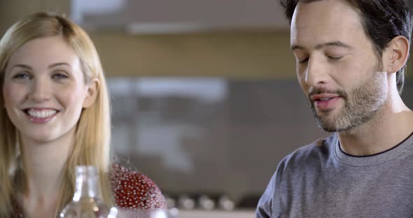 Brunette Man and Blonde Woman Talking Detail