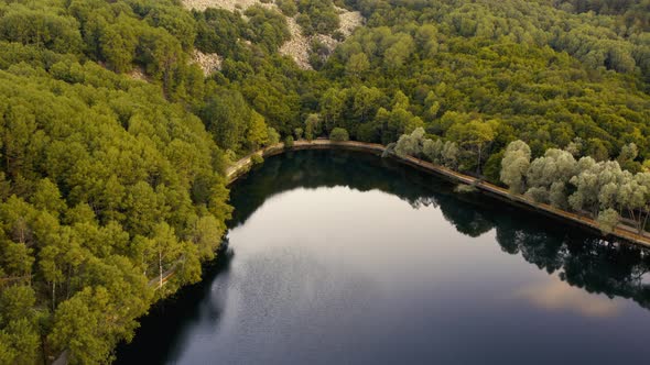 Bird Eye Zoom Descend to Caldera Dark Lake