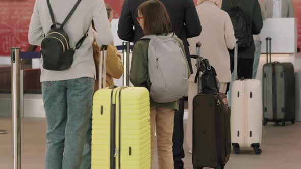 People Waiting In Queue At Check-In