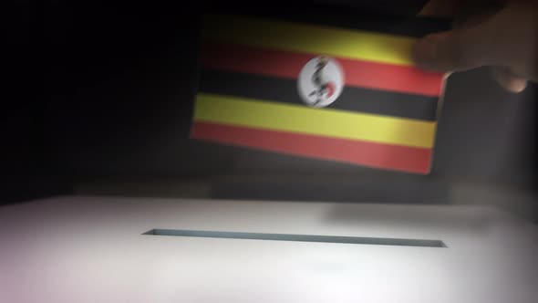 Compositing Hand Voting To Flag OF Uganda