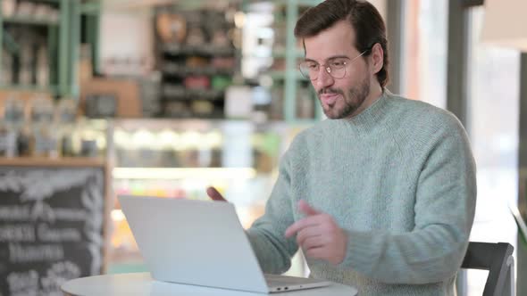 Young Man Talking Video Call Laptop Cafe