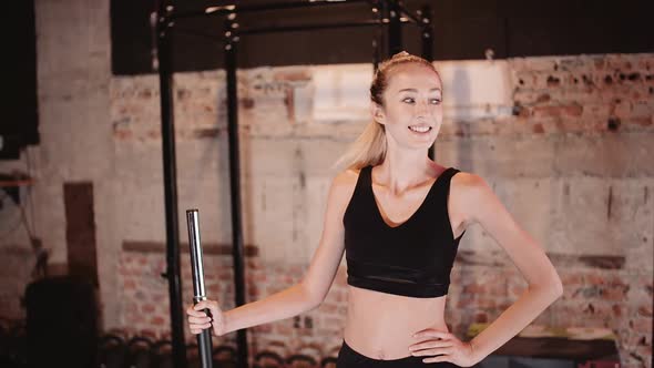 Portrait of Concentrated Woman Looking Camera in Fitness Gym