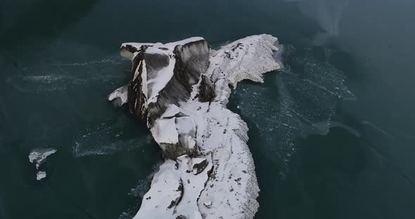 Drone flying over frozen glacier lagoon in Tibet, China, Aerial view drone footage