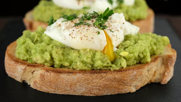 Avocado toast with poached egg close up