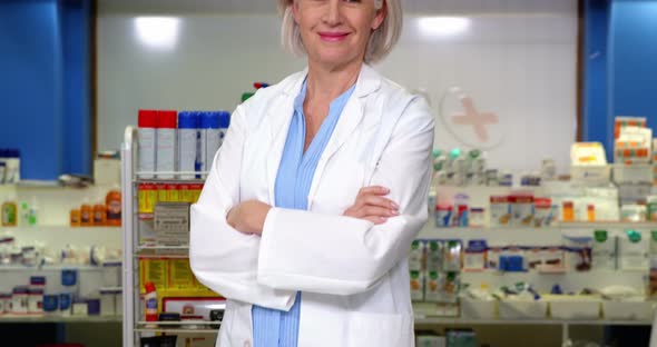 Pharmacist standing at counter in pharmacy