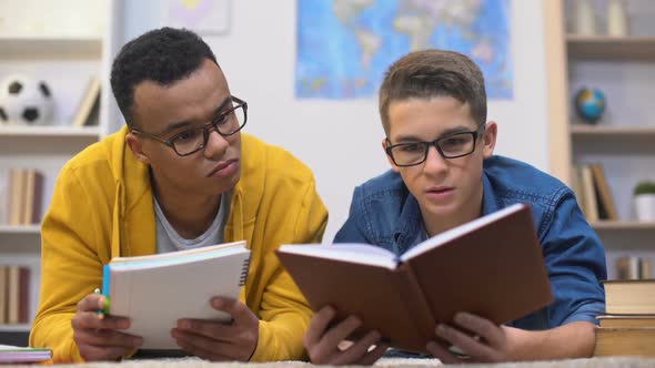Two Multiracial Students Preparing Collective Assignment, College Education
