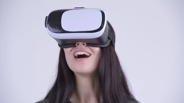 Face of Happy Young Beautiful Woman Using Virtual Reality Headset