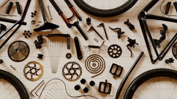 Bike components composed at garage workbench. Endless animation. Top view. 4k HD