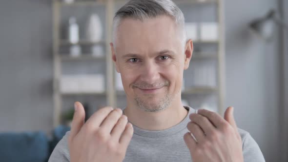 Inviting Gesture By Gray Hair Man