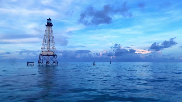 Stunning clip of the ocean and a floating lighthouse in the background in the area of Alligator Reef