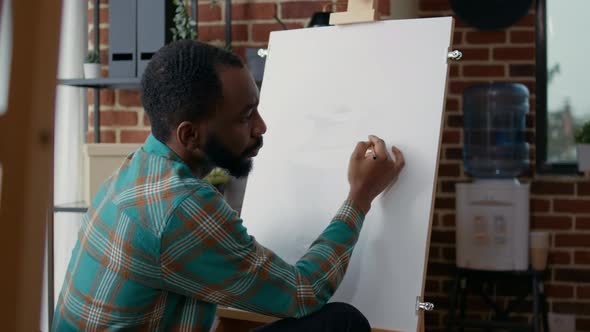 Young Man Learning Drawing Technique on Canvas at Art Class Lesson