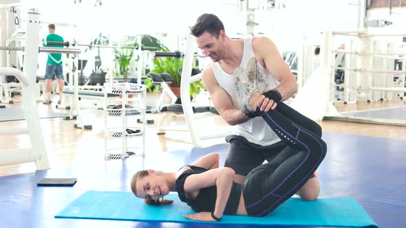 Pretty Woman Working Out with Trainer