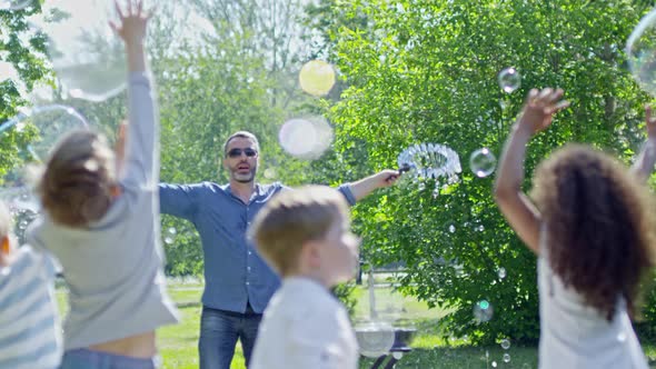 Little Kids Enjoying Amazing Bubble Show Outdoor alt