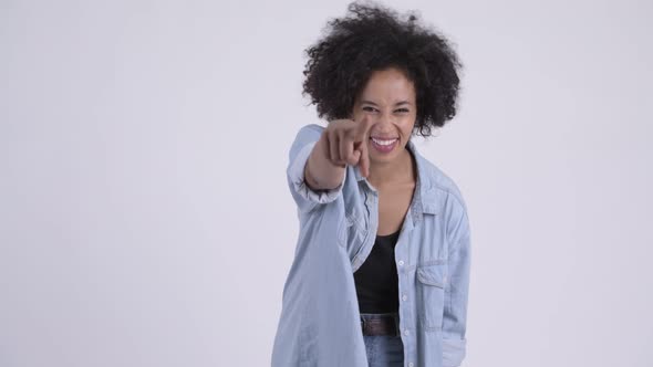 Happy Young Beautiful African Woman Laughing and Pointing at Camera