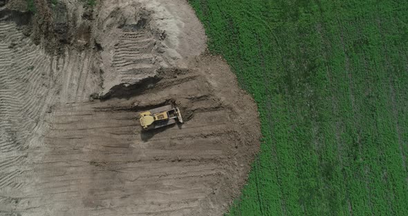 A Crawler Tractor Pushes The Ground With A Bucket Top View 