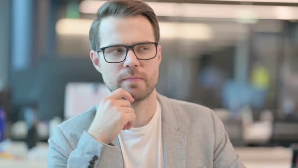 Portrait of Pensive Casual Man Thinking New Plan