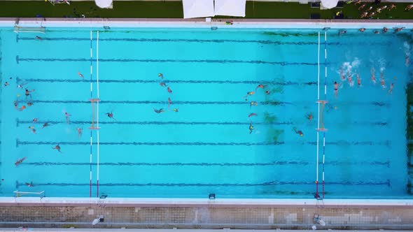 Aerial View Shot of People Competing in Water Polo in Turquoise Water Pool