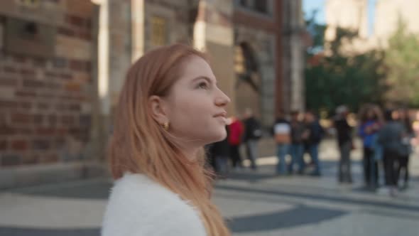 Young Woman Walking In Square In Prague