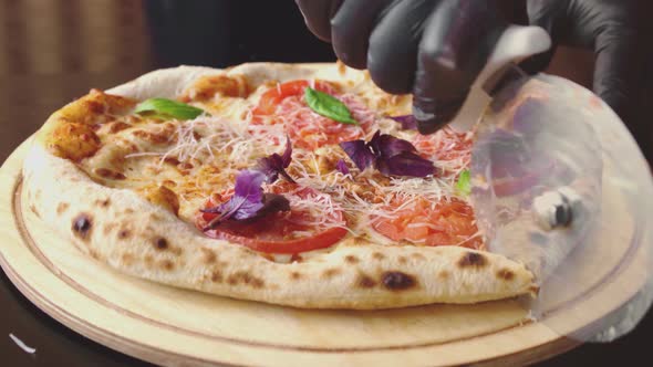 Chef Cuts Freshly Made Pizza with Round Cutter
