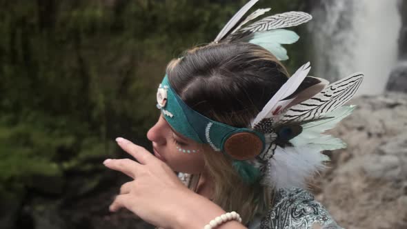 Portrait of Woman Looks Like Indian Shaman in Forest