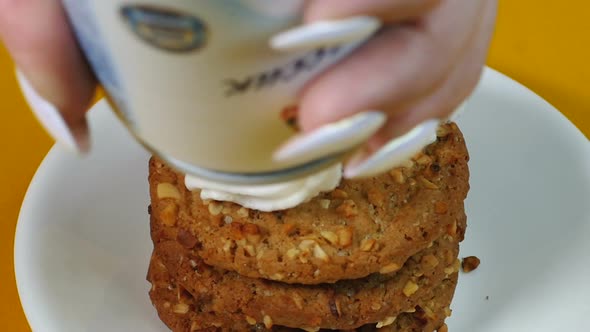 Close-up, Cookies with Nuts Are Covered with Airy White Cream. Cream Is Nicely Laid Out on a Stack