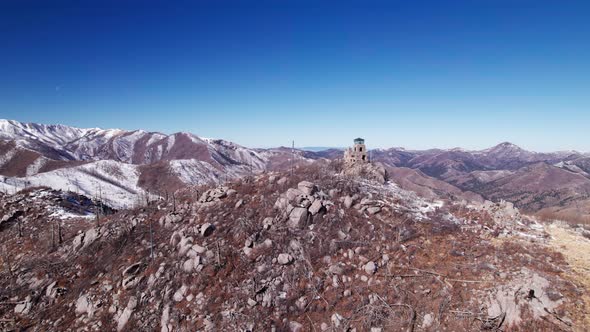 Pull back drone shot of Monjeau Peak in New Mexico on a sunny day