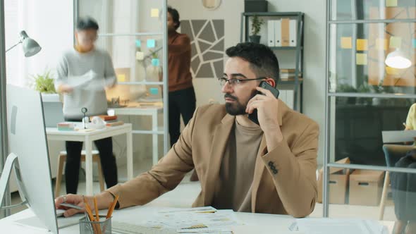 Time Lapse of Middle Eastern Businessman Working in Office