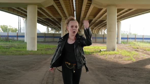 Young Punk Girl Dancing Front Camera Under Car Bridge in City