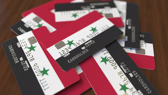 Pile of Credit Cards with Flag of Syria