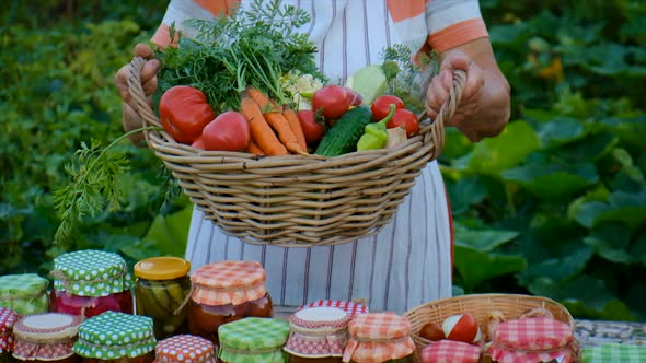 Senior Woman Makes Preservation of Vegetables