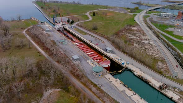 4K aerial footage of a cargo ship at the Beauharnois Canal in the St Lawrence Seaway, Canada.