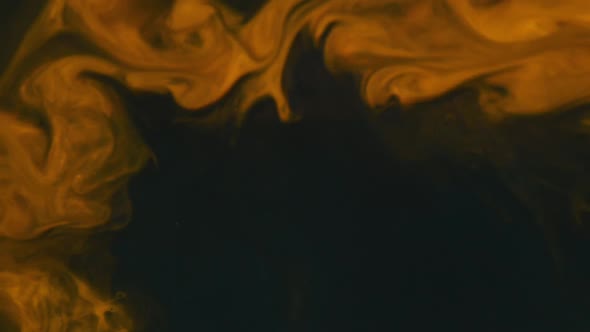 Close Up Of Yellow Acrylic Paint Mixed With Wate alt