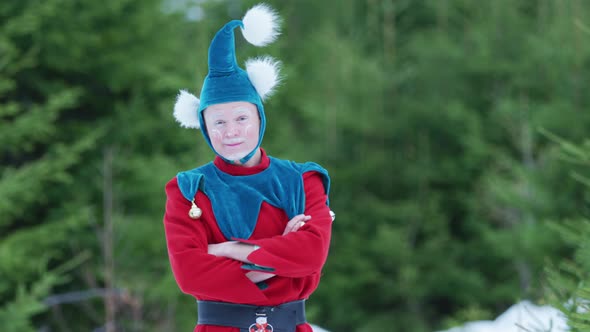 Christmas elf with arm crossed