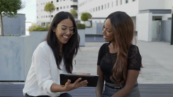 Multicultural Businesswomen Using Digital Tablet in City