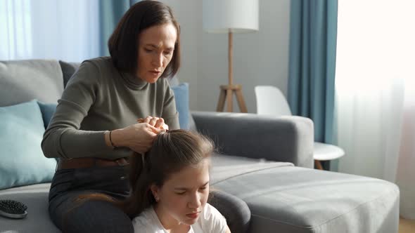 Mom Braids Her Daughter's Pigtail