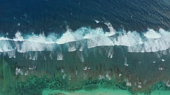 Aerial View of Beautiful Frothy Green Sea Waves Splashing Towards