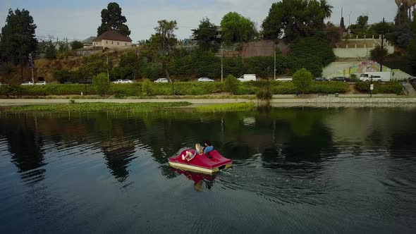 Cute Couple Enjoying A Boat Ride In The Park