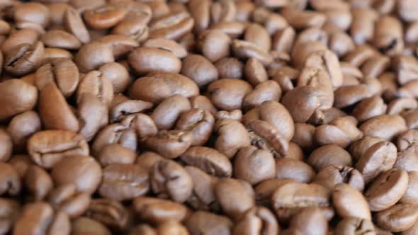 High quality Arabica type coffee beans on table slow dolly shoot moving 4K 3840X2160 UltraHD footage