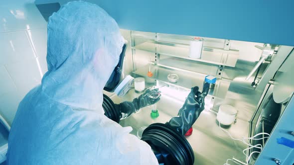 Laboratory Specialist is Using Vacuum Cabinet to Analyze Samples