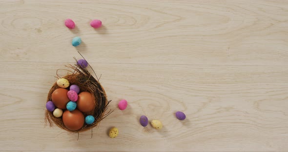 Video of decorated colorful easter eggs on a wooden surface