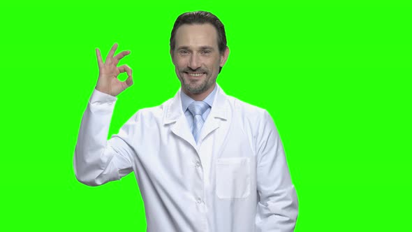 Middle Aged Male Caucasian Doctor with Ok Sign