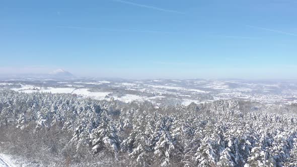 Rtanj mountain valley by sunny winter day 4K aerial video