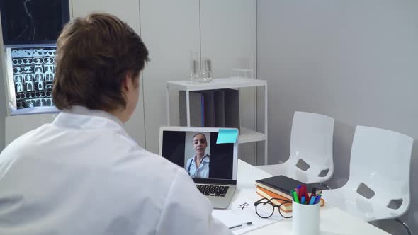 Friends Intern Chatting at Work in Hospital