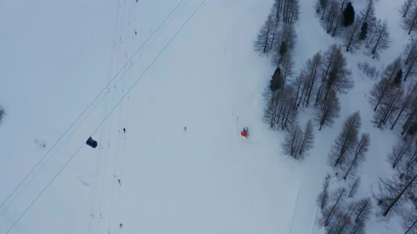 Aerial of busy skiresort, revealing the beautiful snow covered town of Saas-Fee in Switzerland