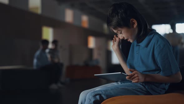 Focused Boy Using Pad Lose in Online Game