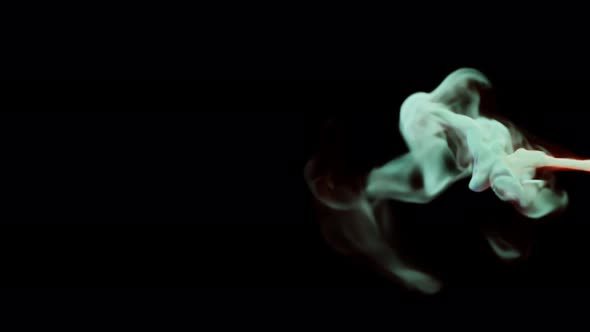 colorful smoke stream on a black studio background can be separated alt