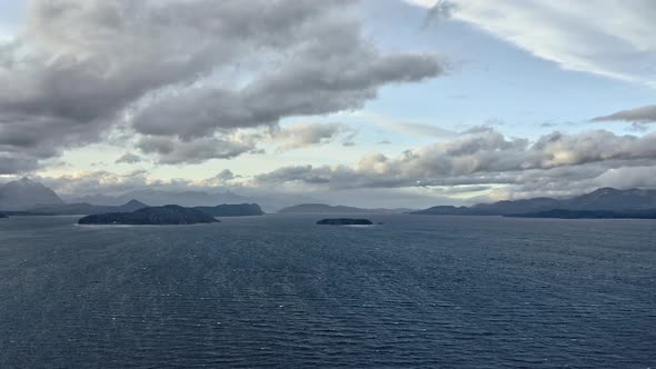 Beautiful View of the Sea Horizon and Silhouettes of Islands Under Cloudy Skies